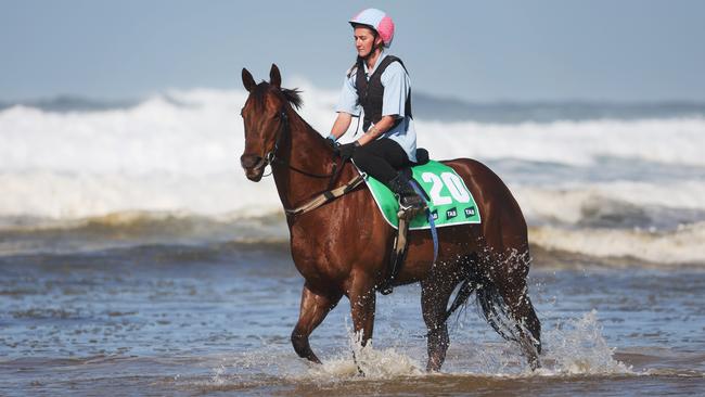 Bella Nipotina and trackwork rider Shannon Durant on the beach at Anna Bay. Picture: Rohan Kelly