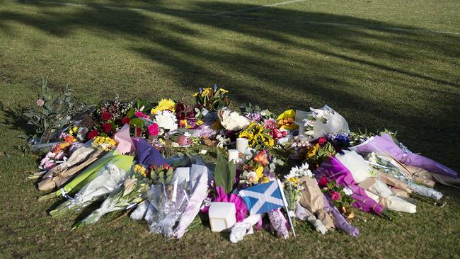 A growing memorial for Eurydice Dixon at Princes Park. Picture: Ellen Smith