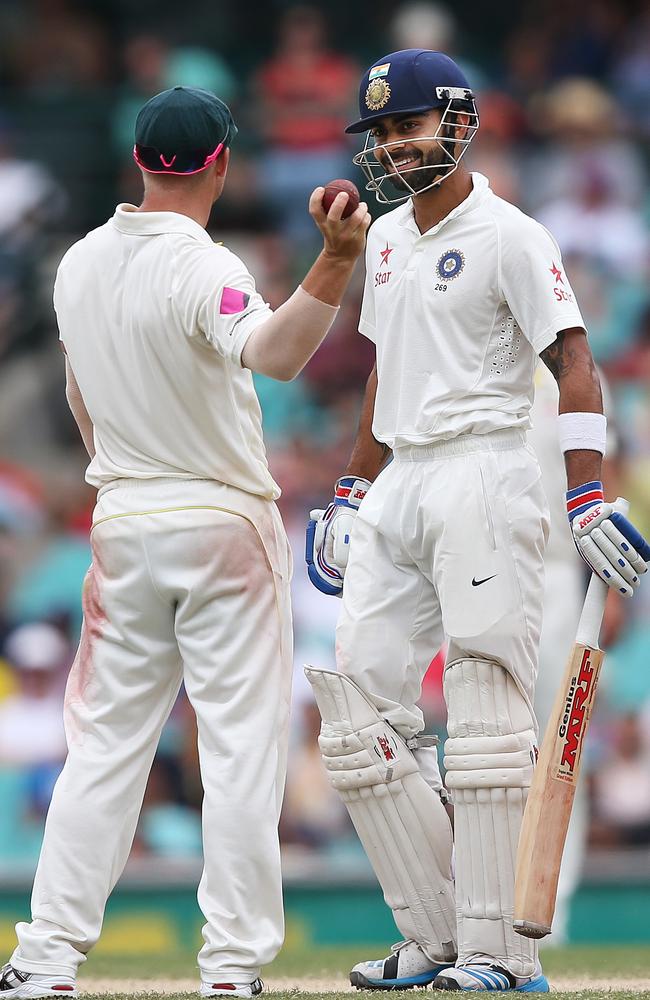 Dave Warner and Virat Kohli exchange pleasantries during the recent Test series.