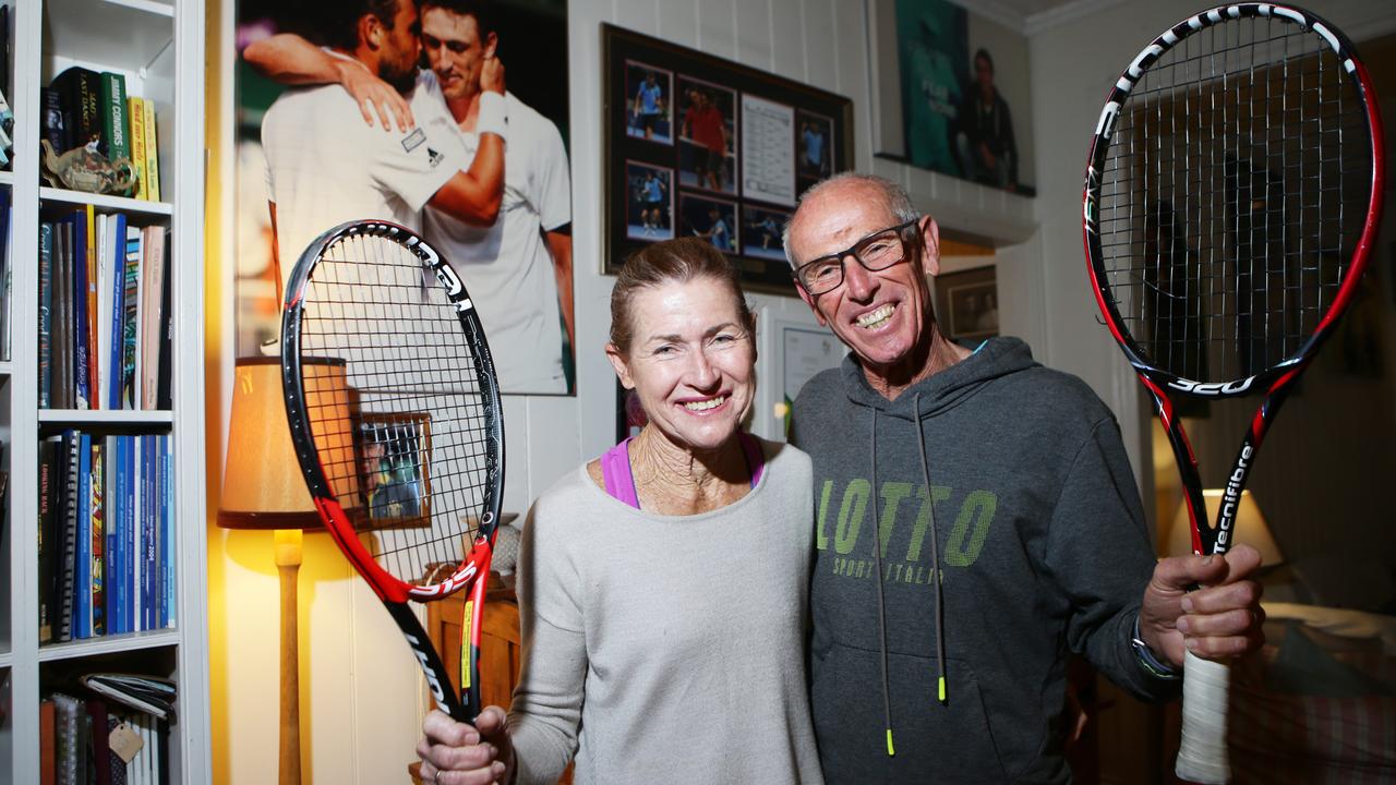 Ron and Shona Millman pose for photos after John Millman beat Roger Federer.