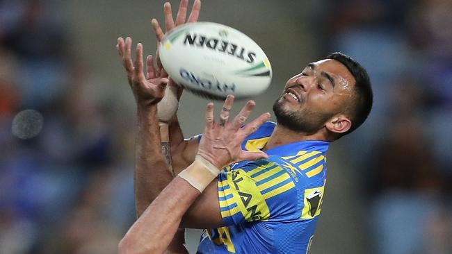 Bevan French of the Eels catches a bomb.