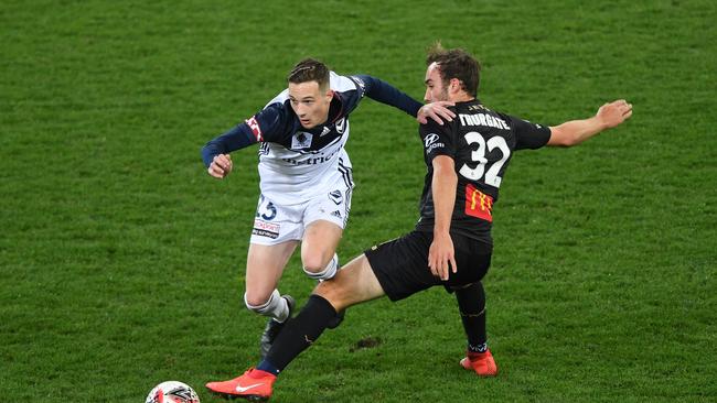 Anthony Lesiotis of the Victory (left) and Angus Thurgate of the Jets contest during the FFA Cup Round of 32 match between the Melbourne Victory and the Newcastle Jets at AAMI Park in Melbourne, Wednesday, August 7, 2019. (AAP Image/Julian Smith) NO ARCHIVING, EDITORIAL USE ONLY