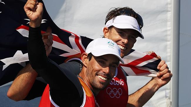 Mathew Belcher and Will Ryan celebrate their silver medal in the men's 470 class at the Marina da Gloria in Rio.