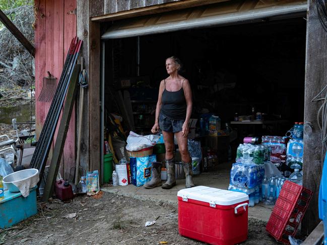 Jane Peterson stands inside her garage filled with relief supplies, outside the family home and business that were destroyed by Hurricane Helene in Green Mountain, North Carolina. Picture: AFP