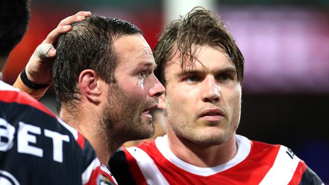 Roosters' Boyd Cordner, left, after a head knock during the NRL match between the Sydney Roosters and Newcastle Knights at the SCG. Picture. Phil Hillyard