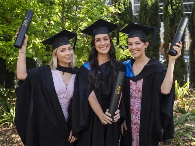 Bachelor of Nursing graduates (from left) Shenoa Trahair, Monique Crilly and Kate Osborne celebrate at a UniSQ graduation ceremony at Empire Theatres, Tuesday, October 31, 2023. Picture: Kevin Farmer