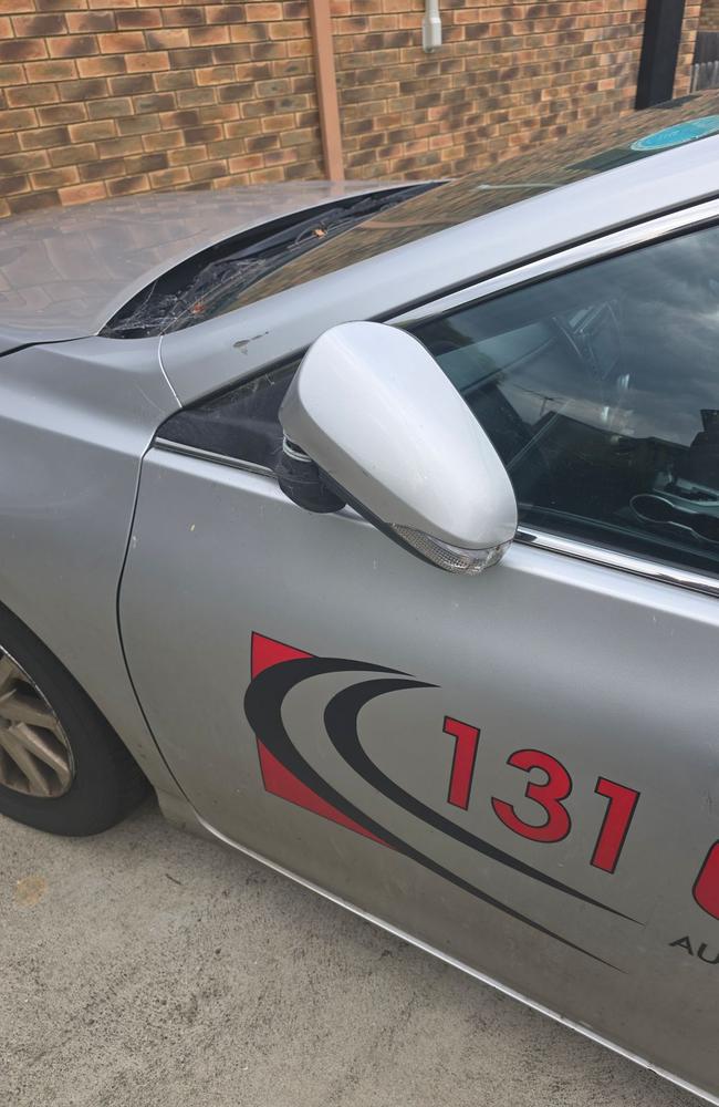 A friend's taxi parked at Ali's property had its rear windshield smashed, dents placed around the car and side mirrors kicked in. Picture: supplied