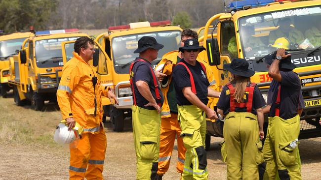 Rural firefighters preparing to fight fires at Spicers Gap, south west of Brisbane, last week. Picture: AAP Image/Darren England