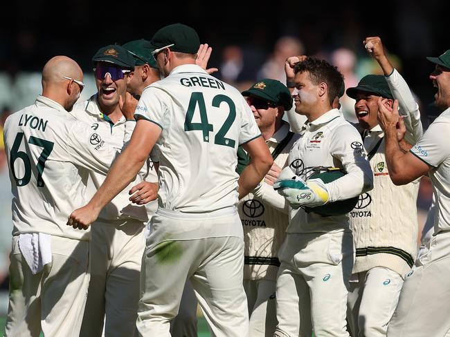 ADELAIDE, AUSTRALIA - JANUARY 18: Team mates celebrate with Nathan Lyon of Australia after dismissing Justin Greaves of the West Indies during day two of the First Test in the Mens Test match series between Australia and West Indies at Adelaide Oval on January 18, 2024 in Adelaide, Australia. (Photo by Paul Kane/Getty Images)