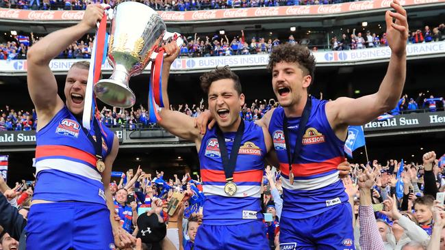 There’s no sweeter walk in footy than a victory lap of the MCG, as jake Stringer, Luke Dahlhaus and Tom Liberatore discovered. Picture: Alex Coppel