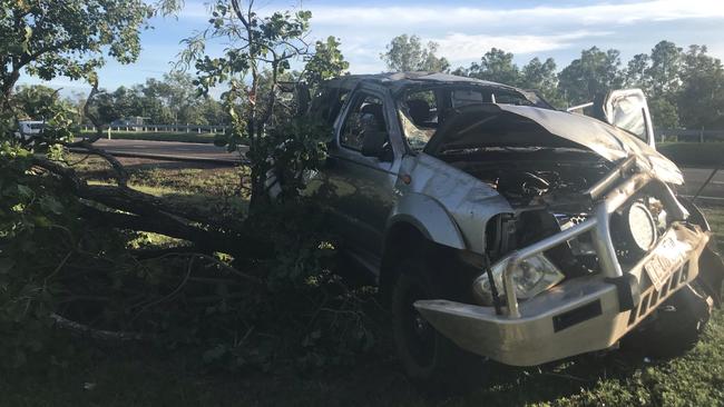 An 18-year-old man was lucky to pull himself from a single vehicle crash this morning on the Stuart Hwy after the car veered off the road and hit a tree. PICTURE: JUDITH AISTHORPE