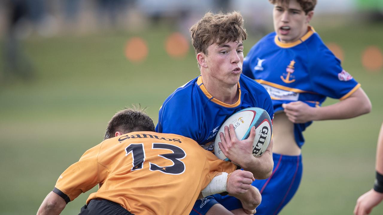 Sydney captain Angus Grover is tackled by Adam Davis. Picture: Julian Andrews