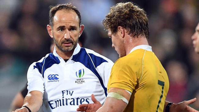 Referee Romain Poite warns Australia’s Michael Hooper of scrum infringements during Saturday night’s Bledisloe Cup clash with New Zealand.