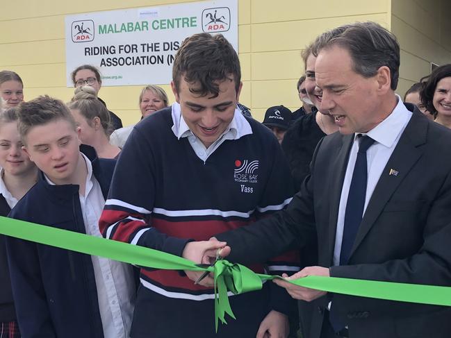 Federal Health Minister Greg Hunt cutting the ribbon at the opening of the new $2 million South East Equestrian Club in Malabar on Friday, July 26.