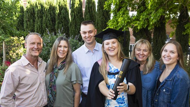 Bachelor of Education (Primary) graduate Jessica Brierley celebrates with (from left) Gavin Brierley, Bronwyn Brierley, Ben Duffield, Annie Duffield and Natasha Brierley at a UniSQ graduation ceremony at The Empire, Tuesday, October 29, 2024. Picture: Kevin Farmer