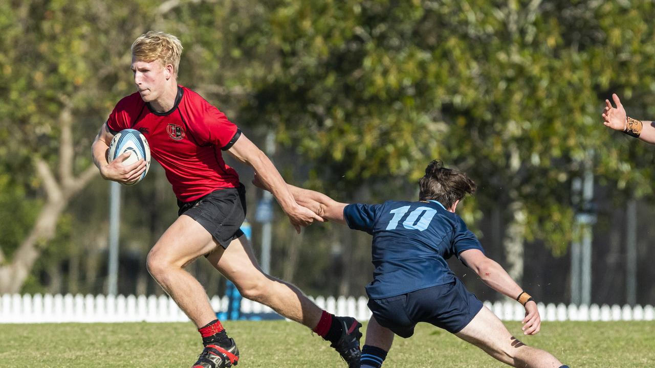 Angus Kelly runs past Ryan Shaw in the GPS 1st XV Rugby game between Brisbane Grammar and Gregory Terrace at Northgate, Saturday, July 30, 2022 - Picture: Richard Walker