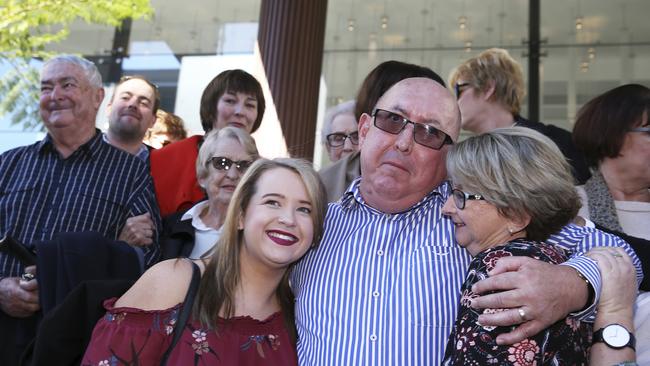 Victim Peter Creigh embraces family members outside the Newcastle Court after Tuesday’s guilty verdict.