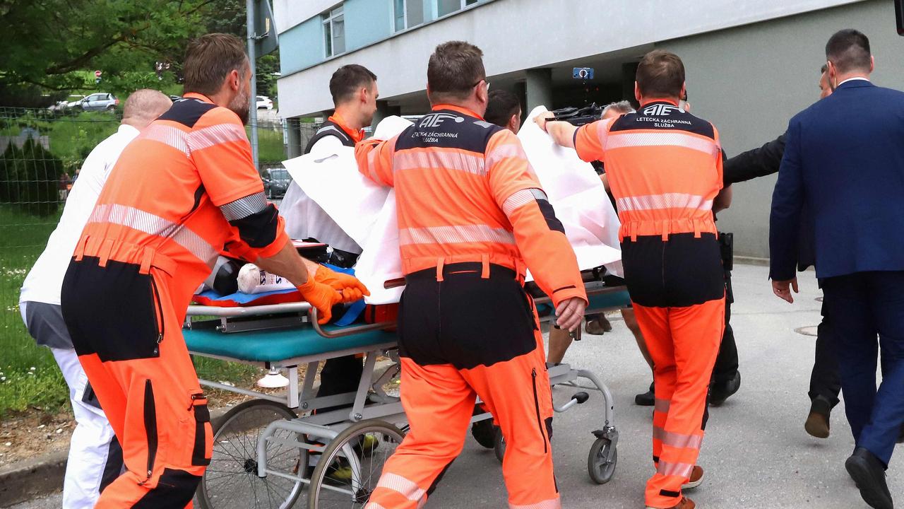 Picture taken on May 15, 2024 shows Slovak Prime Minister Robert Fico being transported by medics and his security detail to the hospital in Banska Bystrica, Slovakia where he is to be treated after he had been shot "multiple times" (Photo by AFP) / ALTERNATIVE CROP
