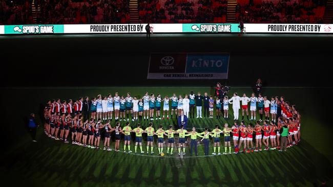 Players, coaches and officials are seen as part of Spud's Game ceremony. Picture: Dylan Burns/AFL Photos via Getty Images