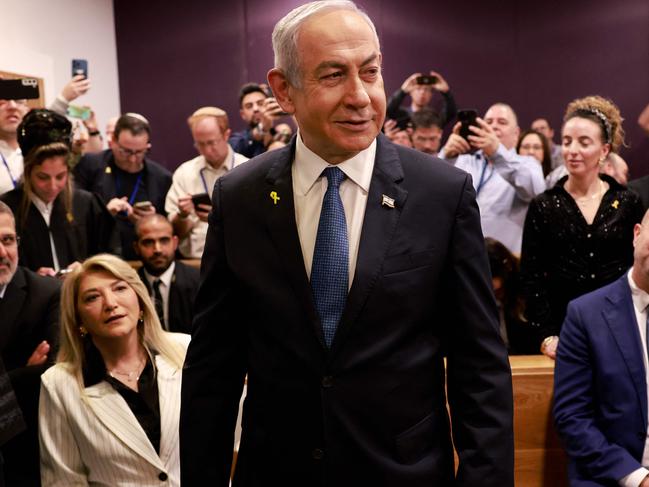 TOPSHOT - Israeli Prime Minister Benjamin Netanyahu attends a hearing in his trial on corruption charges at the district court in Tel Aviv on December 10, 2024. Netanyahu, the first sitting prime minister of Israel to face a criminal trial, testified for the first time when his corruption case resumed on December 10 on charges of bribery, fraud and breach of public trust in three separate cases. (Photo by Menahem Kahana / POOL / AFP)