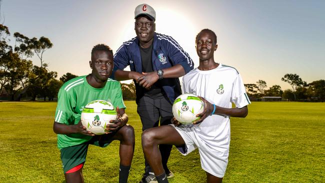 Nile United players Awal Dut and Jok Akuien with coach Arok Akoi Arok at Kalara Reserve in Davoren Park. Picture: Brenton Edwards