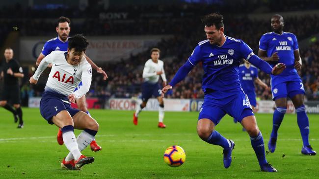 Son Heung-min shoots past Sean Morrison of Cardiff City as he scores Spurs’ third goal. Picture: Getty Images
