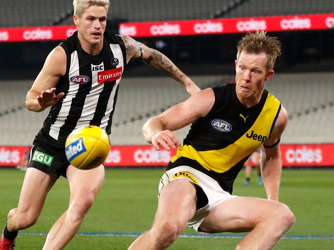 MELBOURNE, AUSTRALIA - JUNE 11: Jack Riewoldt of the Tigers and Jack Crisp of the Magpies in action during the 2020 AFL Round 02 match between the Collingwood Magpies and the Richmond Tigers at the Melbourne Cricket Ground on June 11, 2020 in Melbourne, Australia. (Photo by Michael Willson/AFL Photos via Getty Images)