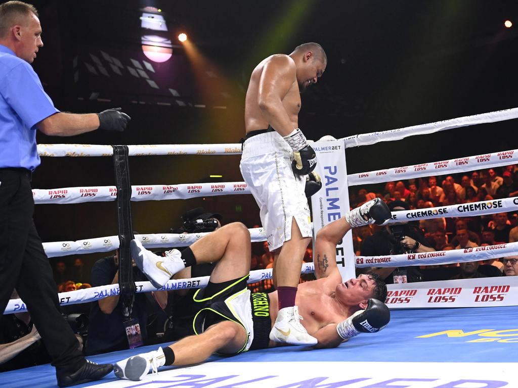 Joey Leilua stands over Chris Heighington during their bout. Picture: Jeremy Piper