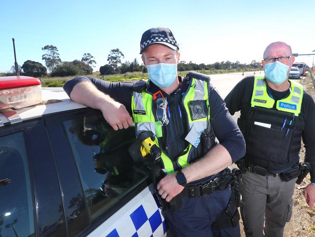 DSC Damian McKeegan and his son Constable Xavier McKeegan who are working a shift at the Little River checkpoint.  picture: Glenn Ferguson