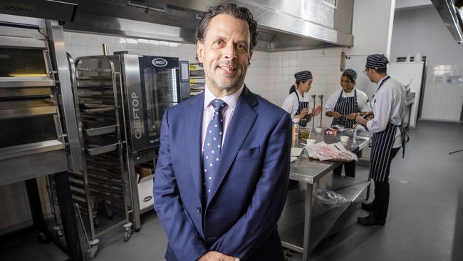 TasTAFE new CEO Grant Dreher with Cert IV Cookery students, Monrutai Chulaluxsananukul, Hirushi Udawatta and Nicolas Pachon. Picture: Richard Jupe