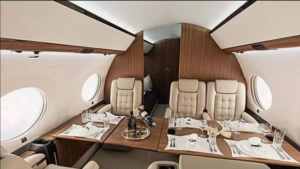 Inside, the jet accommodates 19 passengers and offers high-end amenities, including leather recliner seats, a dining area, a fully stocked bar and a private bedroom. Picture: Gulfstream