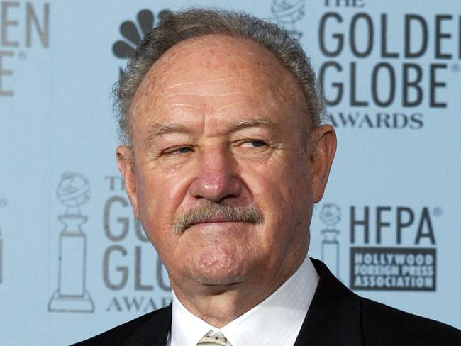 (FILES) US actor Gene Hackman holds the Cecile B. DeMille Award at the 60th Annual Golden Globe Awards in Beverly Hills, California, on January 19, 2003. Oscar-winning actor Gene Hackman died of natural causes about a week after his wife's death, a medical examiner said on March 7, 2025, ending more than a week of mystery surrounding the death of one of Hollywood's most beloved stars. The bodies of "The French Connection" star and his wife were found on February 26 in their home in New Mexico after emergency services were called to their property. (Photo by HECTOR MATA / AFP)