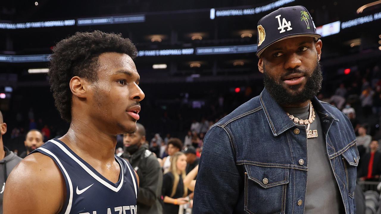 PHOENIX, ARIZONA - DECEMBER 11: Bronny James #0 of the Sierra Canyon Trailblazers and father LeBron James of the Los Angeles Lakers walk off the court following the Hoophall West tournament at Footprint Center on December 11, 2021 in Phoenix, Arizona. (Photo by Christian Petersen/Getty Images)