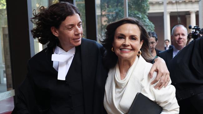 Sue Chrysanthou SC hugs Lisa Wilkinson as they emerge from court on April 15, 2024 in Sydney, Australia. Justice Michael Lee has ruled in favour of Network Ten and journalist Lisa Wilkinson in Bruce Lehrmann's defamation case. Picture: Getty Images