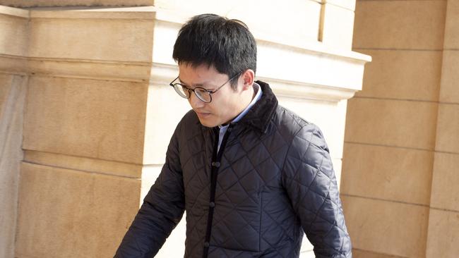 Property fraudster Mo Du, 36, leaves the District Court after sentencing submissions in September. Picture: Brett Hartwig