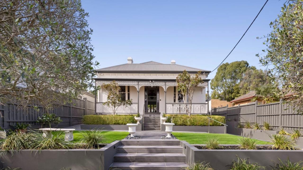 Privately set behind a high wall and automatic gates, the double-fronted Victorian-era home blends heritage charm with modern luxury.