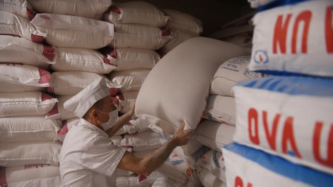 An employee carries a bag of flour in a storage of a bakery in Istanbul, Turkey. The Russian invasion of Ukraine has caused a major spike in world food prices. Photo: Burak Kara / Getty Images