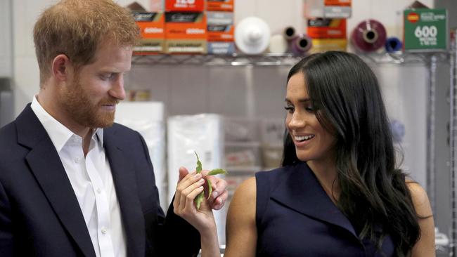 The royal couple seem impressed with what’s on offer at Charcoal Lane. Picture: AP