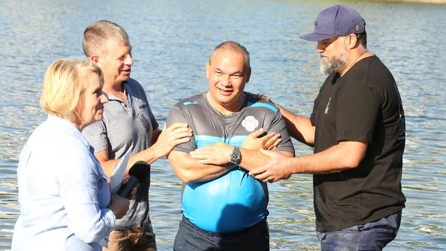 Tom Tate getting baptised at Evandale Lake during a combined churches service by Pastor Sue Baynes and helpers Marshall Gray (right) and Rodger Baynes (left) in 2018. Picture: Mike Batterham