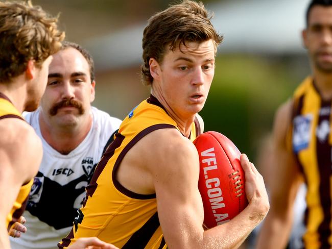 MELBOURNE, AUSTRALIA - MAY 20: Henry Hustwaite of the Box Hill Hawks attempts to evade being tackled during the round nine VFL match between Box Hill Hawks and Southport Sharks at Box Hill City Oval on May 20, 2023 in Melbourne, Australia. (Photo by Josh Chadwick/AFL Photos/via Getty Images)