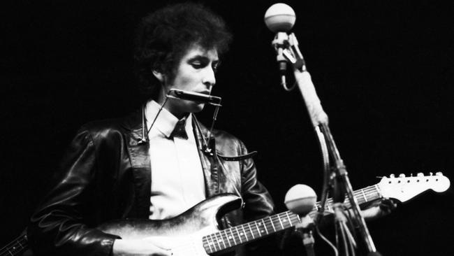 Dylan goes electric at the Newport Folk Festival in July 1965 on Rhode Island. Picture: Getty Images.