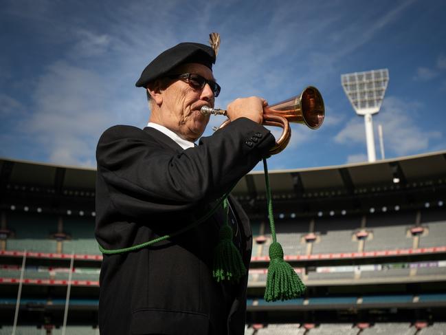 John Mansfield plays the bugle during the AFL Anzac Day Ceremony at the Melbourne Cricket Ground.