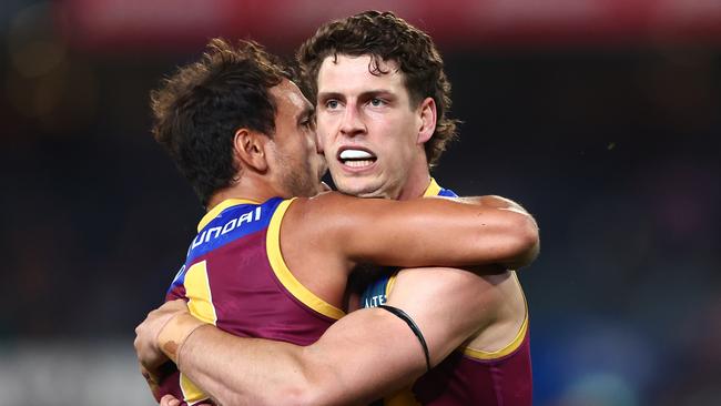 Brisbane midfielder Jarrod Berry (right) has recommitted to the Lions until the end of 2029. Picture: Chris Hyde / Getty Images