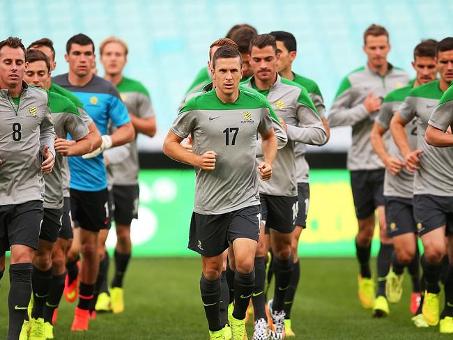 SYDNEY, AUSTRALIA - MAY 25: Australian players warm up during an Australian Socceroos training session at ANZ Stadium on May 25, 2014 in Sydney, Australia. (Photo by Brendon Thorne/Getty Images)