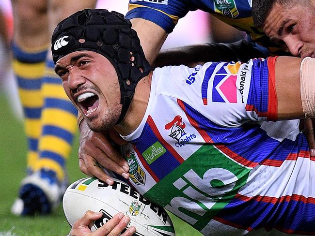 Sione Mata'utia of the Knights scores a try during the Round 13 NRL match between the Parramatta Eels and the Newcastle Knights at ANZ Stadium in Sydney, Saturday, June 2, 2018. (AAP Image/Dan Himbrechts) NO ARCHIVING, EDITORIAL USE ONLY