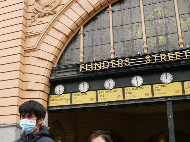 Victorians could be urged to wear masks as cases continue to climb. Picture: AAP Image/Scott Barbour