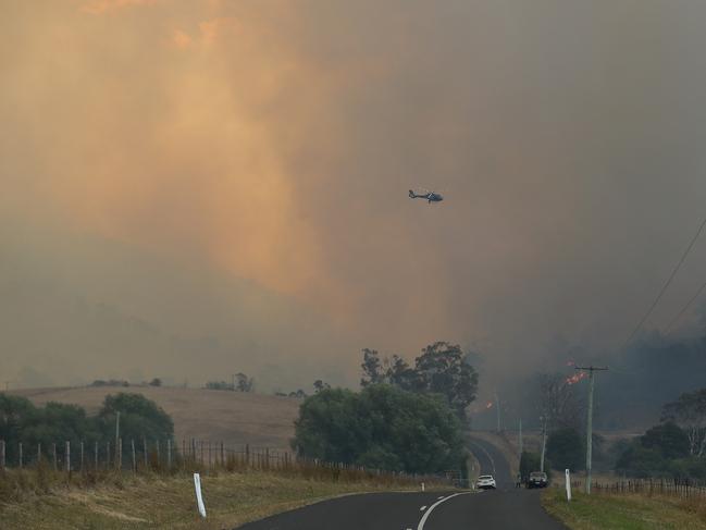 Helicopters monitor the bushfire front on Elderslie Rd. Picture: LUKE BOWDEN