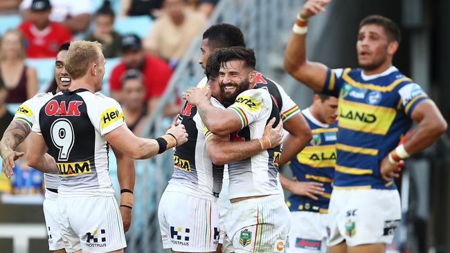 SYDNEY, AUSTRALIA — APRIL 08: Josh Mansour of the Panthers celebrates with team mates after scoring a try during the round five NRL match between the Parramatta Eels and the Penrith Panthers at ANZ Stadium on April 8, 2018 in Sydney, Australia. (Photo by Brendon Thorne/Getty Images)