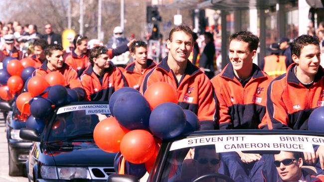 Melbourne players Steven Pitt, Cameron Bruce and Brent Grgic during the 2000 Grand Final Parade.