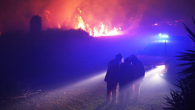 Firefighters on the scene of a bushfire that threatened homes along Palm Meadows Drive and the Boonaroo Park area. Picture: Glenn Hampson.